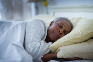 a woman sleeping in a cozy warm bed